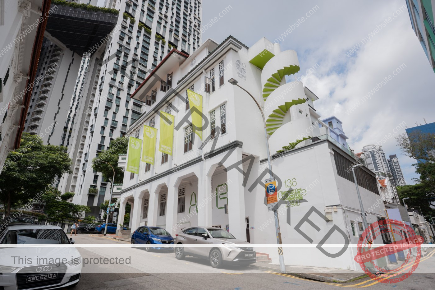 136 and 138 Neil Road with its green external spiral staircase